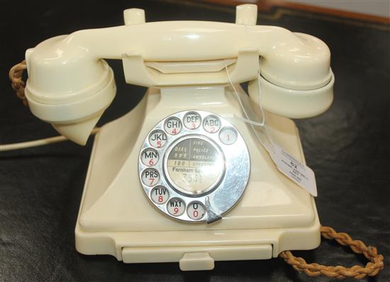 An ivory Bakelite 232L pyramid telephone,